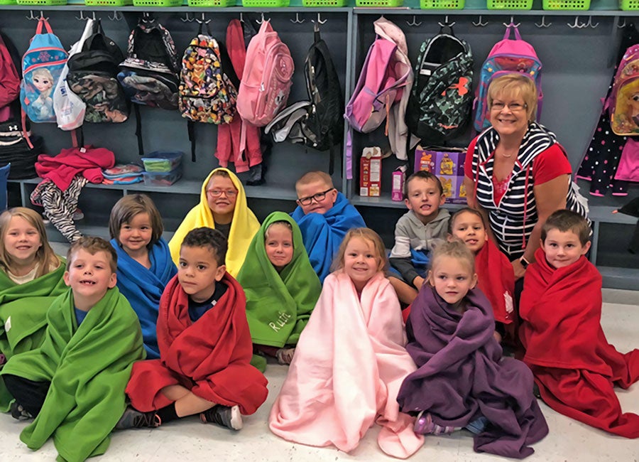 Mona delivering blankets to Kindergarten class